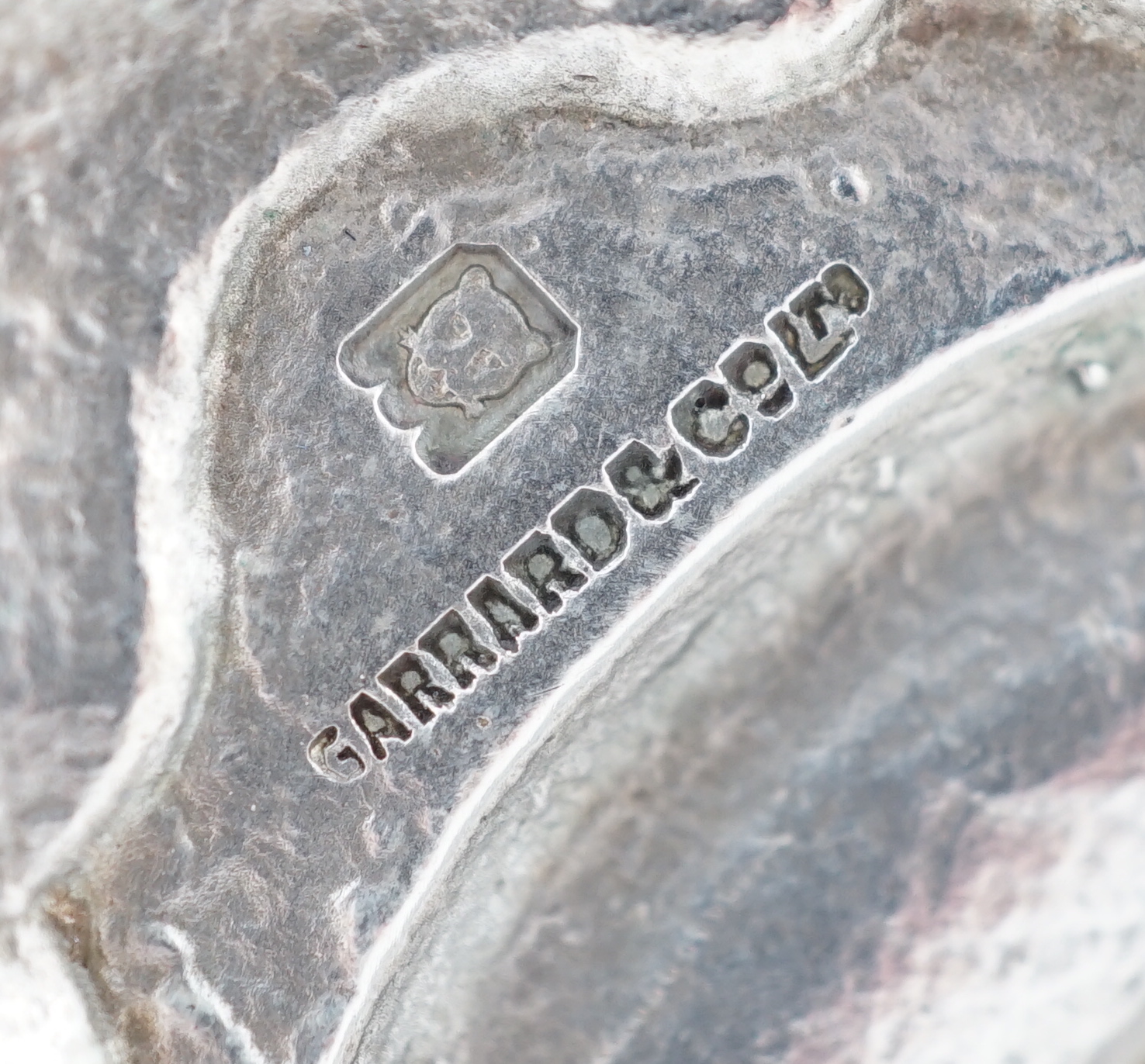 A pair of George V silver tapersticks by Sebastian Garrard for Garrards